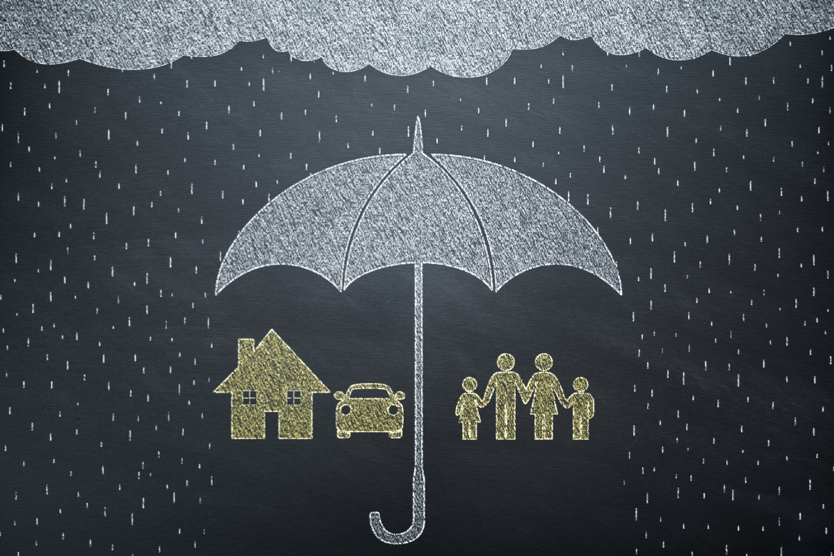 Image of umbrella protecting home, vehicle, and family from rain to illustrate umbrella insurance.
