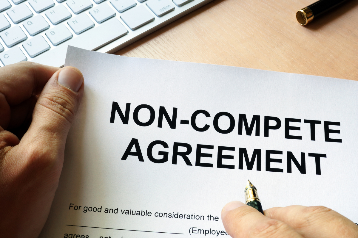 Person holding non-compete agreement