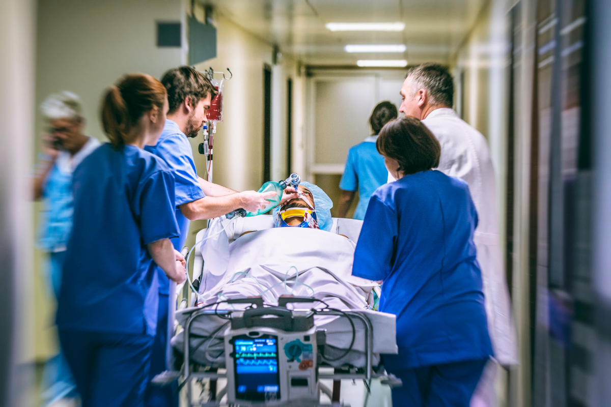 Emergency department staff working on patient