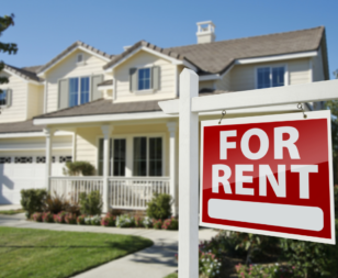 For rent sign in front of residential home
