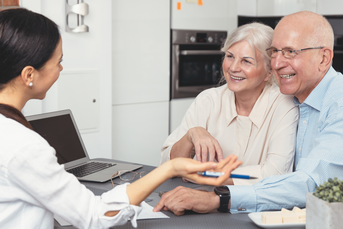 older couple having a meeting with woman